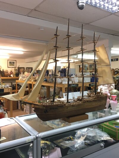 A large model vintage wooden ship featuring multiple masts, intricate rigging, and cloth sails, representing a classic tall ship or galleon design.no reserve 100cm tall 125cm wide