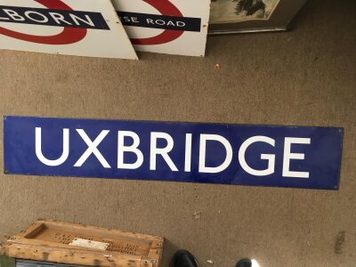 An enamel underground station sign for Uxbridge, approx 149cm x 27cm.