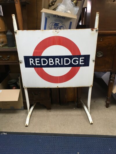An enamel underground station sign for Collier's Wood on a metal stand, total approx 72cm x 107cm..