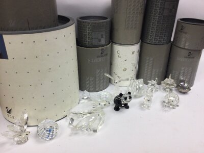 A collection of boxed Swarovski crystal glass figures