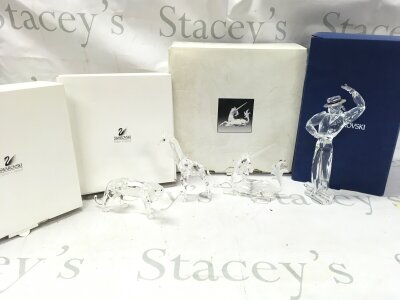 Four boxed Swarovski crystal glass figures including 2003 SCS Annual Edition "Antonio" from the "Magic of Dance" trilogy., baby giraffe, the unicorn , tiger