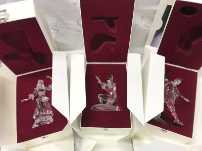 Three boxed Swarovski crystal glass masquerade figures. No obvious damage or restoration