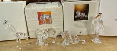 Swarovski figures (all in good condition), African Lion, African Elephant, Crane, Giraffe.