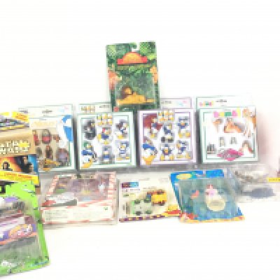 A Collection of Various Boxed Disney Figure sets. Micro Machines. Etc.no reserve.