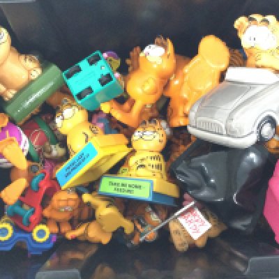A Box Containing a Collection of Garfield Figures and Ornaments.