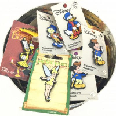 A Collection of Disney Plastic Badges.