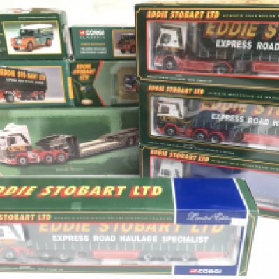 A Box Containing Mostly Boxed Corgi Edie Stobart Vehicles.