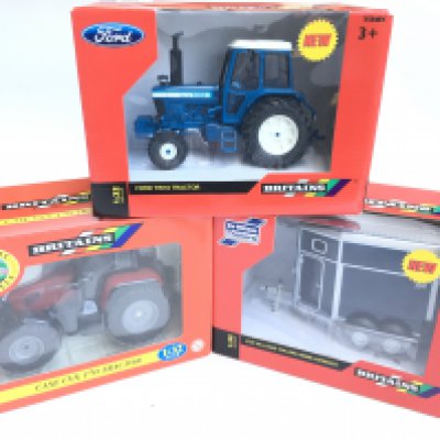 A Boxed Britains Ford TW10 Tractor #42839. A Case CVX 170 Tractor #40063 and a Horsebox #42916.
