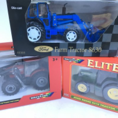 A Boxed Britains Case IH Maxxum 110 Tractor And Loader #42688. A John Deere 6410 Tractor #00175 and a New Ray Ford Farm Tractor 8630.