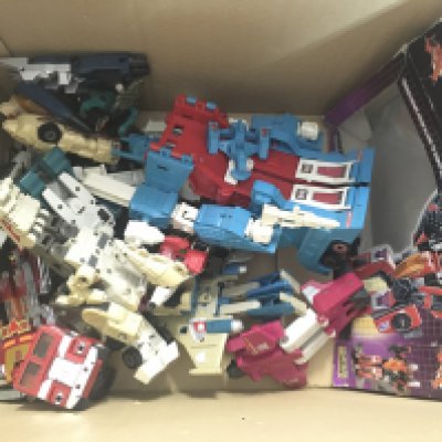 A Box Containing G1 Transformers and Empty Boxes.