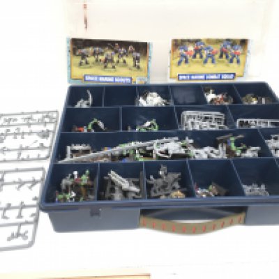 A box containing a selection of metal and plastic models and accessories some painted.