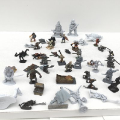 A box containing approximately 50 metal model figures and accessories from a Warhammer collection. Mostly painted. Made by GRENADIER..RAL PARTHA and others.