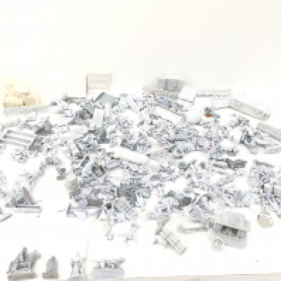 A box containing in excess of 100 mainly metal figures and accessories from a Warhammer collection. All are unpainted. Made by Grenadier..Ral PARTHA and others.