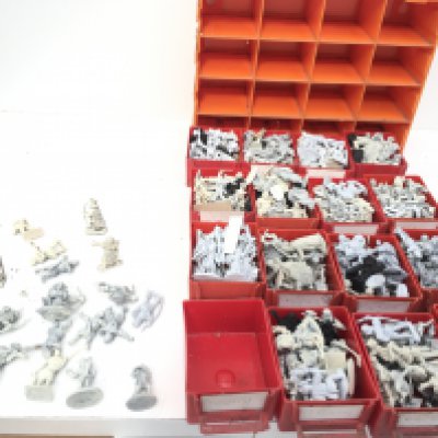 A set of plastic storage drawers contains approximately 300 metal model figures from. Warhammer collection all unpainted. Made by Ral PARTHA..Grenadier and others..