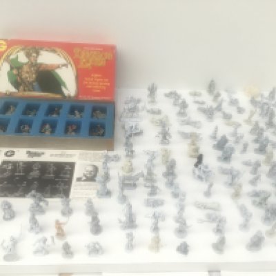 A box contains in excess of 130 metal model figures from a Warhammer collection. All unpainted and made by RAL PARTHA..GRENADIER..and others Also includes a box entitled Dragons Lords of 12 painted figures.