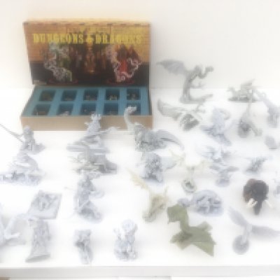 Two boxes containing approximately 45 metal figures from Warhammer collection . One Dungeons and Dragons box contains 11 painted figures. Made by Ral PARTHA and Grenadier