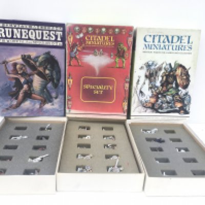 3 boxes containing painted metal figures from a warhammer collection.