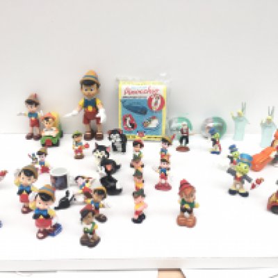 A group in excess of 30 Disney figures mostly Pinocchio and friends. Includes a variety of items including figures..vehicles..beach ball etc.