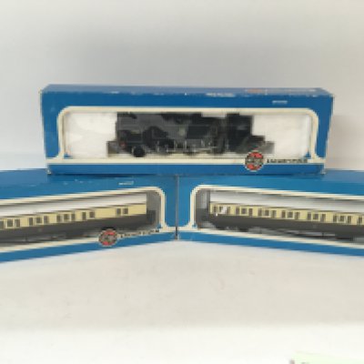 A Boxed 00 Gauge Airfix prairie Tank Locomotive and 2 Coaches.
