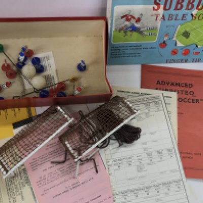 A 1959 Subbuteo set. Pitch missing.