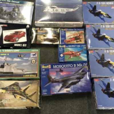 A Collection of Various Model Kits Some have Been Started.