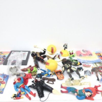A collection in excess of 30 items relating to superheroes including figures..vehicles and accessories