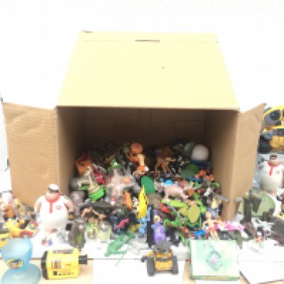 A large collection of toys including Disney characters and numerous others.