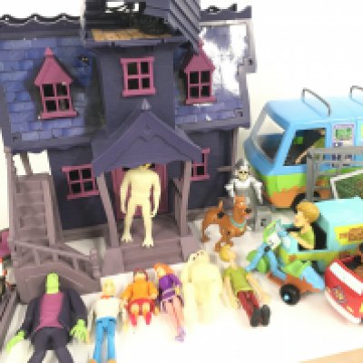A Collection of Scooby Doo Figures and Play set.