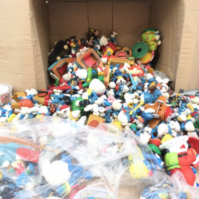 A box containing in excess of 250 Smurf figures from numerous years.