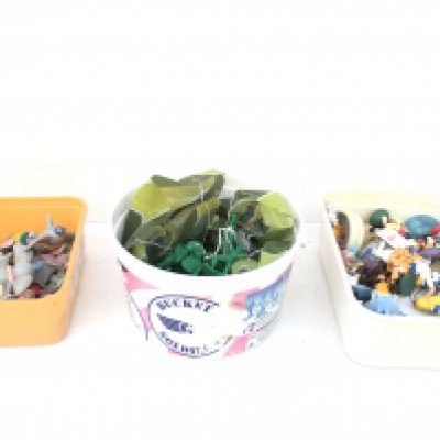 Three containers 1 with Dumbo related pieces.. 1 with Alice in Wonderland pieces and 1 with plastic soldiers Disney Pixar.