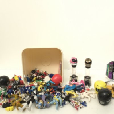 A collection of Power Rangers figures and accessories.