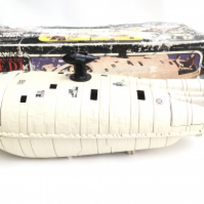 A BoxedVintage Star Wars Rebel Transport. Box is Worn. Comes with the Hoth Back Packs and Asteroid Gas Masks. 1 Cannon Missing. NO RESERVE