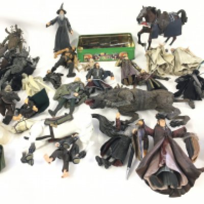 A large box containing in excess of 50 model action figures from the LORD OF THE RINGS series. Some active figures included plus a tin contains a large selection of weapons.