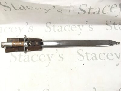 A Swiss Pioneer saw back bayonet M1914 with leather frog with maker's marks. 64cm total length, blade 48cm long
