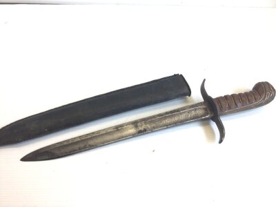 A 19th century short sword the steel blade with faint inscription wired grip and leather scabbard. Length 42cm
