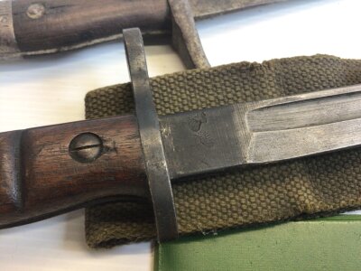 A I world war Bayonet Remington 1917 with wood grip and leather scabbard with etched personalised inscription and a 1907 pattern bayonet no scabbard (2)