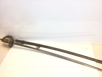 A Spanish 19th century sword with an elaborate gilt brass guard wired shagreen grip, the blade with engraved decoration and name Antonio Guzman.