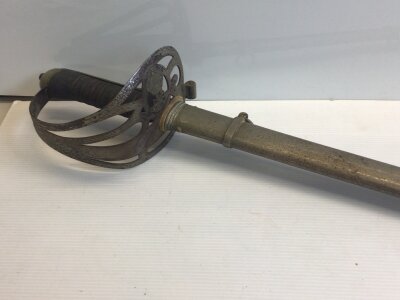 A British 1827 pattern officers sword Rifle Volunteers the blade with Cypher of George V. Maker Pulford & Son 65 St James Street SW1.