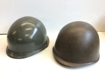 An American Vietnam period helmet and a Russian M52 helmet both with liners (2)