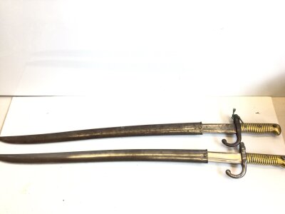 Two Fench 19th Century Yatagan Sword bayonets 1869 and 1870 with engraved steel blades and brass grips (2)