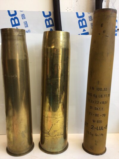 Three large Shell cases one with engraved decoration’ Two The Globe Trotters’ height 70cm (3)