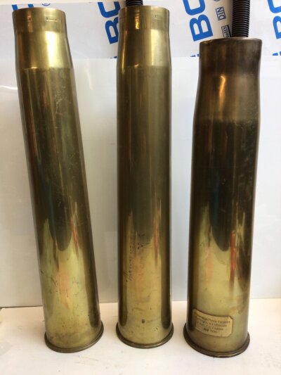 Three Artillery Shells two 3.7 Anti Aircraft gun shell cases one dated 1942 and one other shell case with a presentation plaque ETC Foulness 1998 (3)