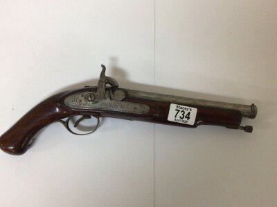 A 19th century Percussion pistol with engraved steel action and canon type steel barrel walnut stock. Length 36cm