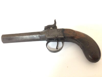 A 19th century Percussion pocket pistol with an octagonal twist off barrel engraved slab sided action. Length 18cm.