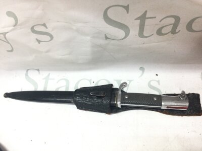 A K98 German Dress Bayonet and frog (no maker). Blade 19cm long. Total knife long 38cm