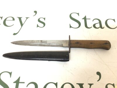 A German Third Reich Luftwaffe Boot Knife with a wood grip the steel blade with a small stamped mark. Nice original condition.