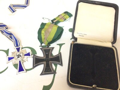 A German Imperial I world war iron cross with ribbon a German medal box and a Silver German Mother cross the reverse 16th December 1938 (3)