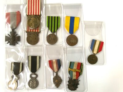 A collection of French medals to include, War Cross for Foreign Operational Theatres (Croix de guerre des théâtres d'opérations extérieurs), 1914–1918 Commemorative war medal (2), French WWI Veteran's Association medal (Union des Combattants (U.N.C.) medal) with 5 additional french awards