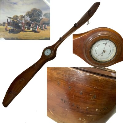 A WW1 era full size propeller for SE5A fighter plane, various impressed markings, wall and coat mounts with barometer section.