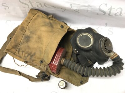 A WW2 British gas mask in canvas bag